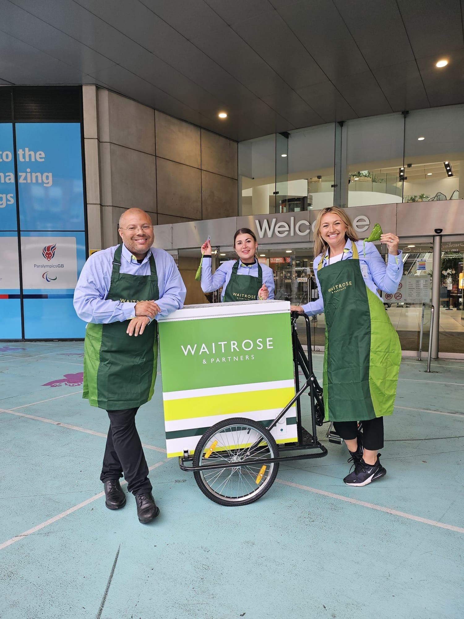 Team smiling by Waitrose entrance